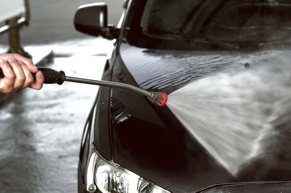 Using pressure washer to clean car bonnet