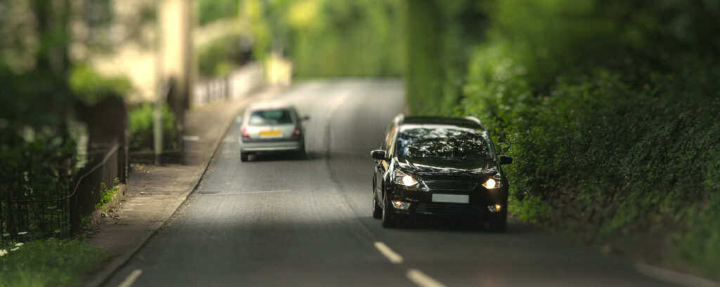 Cars passing one another in the street