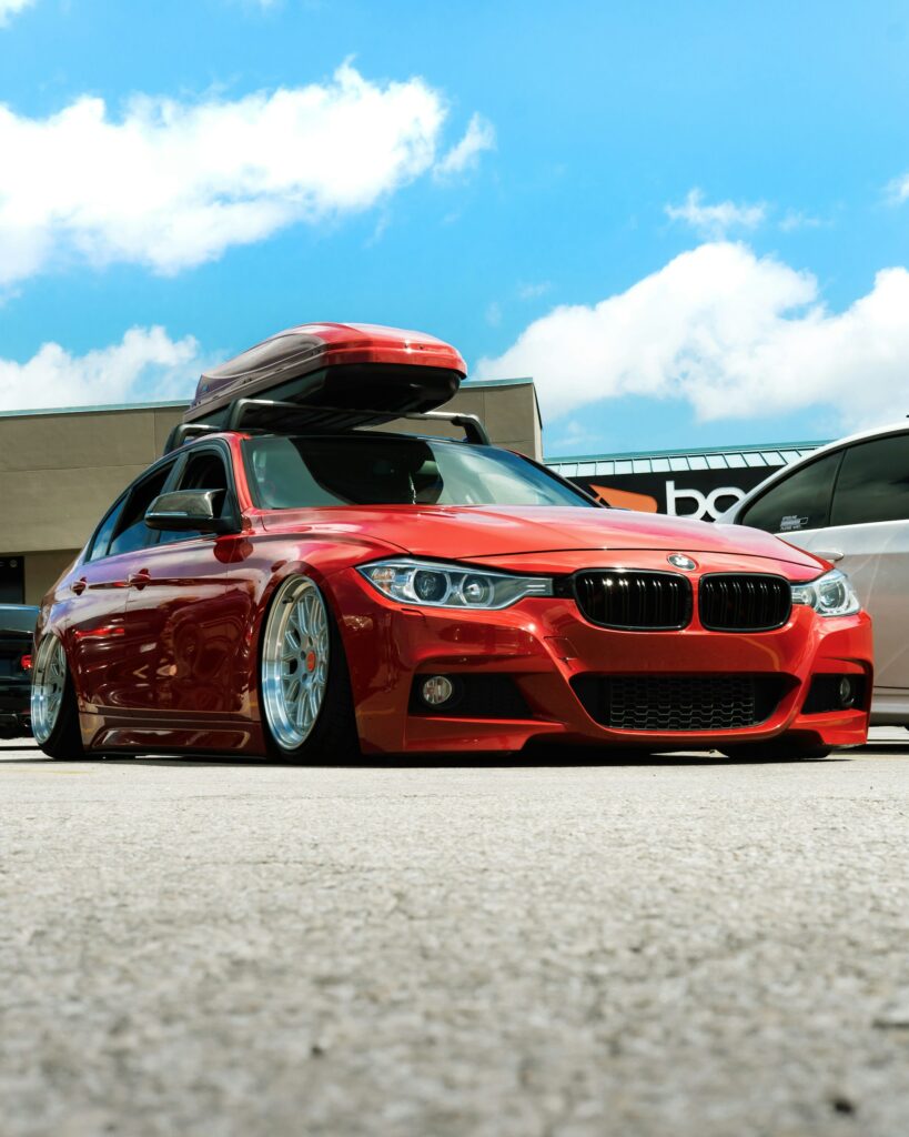 Modified Red saloon, lowered, low profile tyres – Keith Michaels Insurance